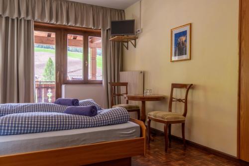 Postel nebo postele na pokoji v ubytování Appartements Pension Sonia