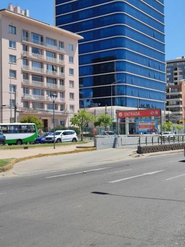 an empty street in a city with tall buildings at NOT FOUND Hostel in Viña del Mar