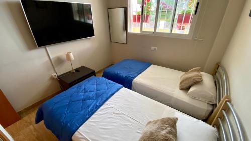 Postel nebo postele na pokoji v ubytování Caleta Vyb
