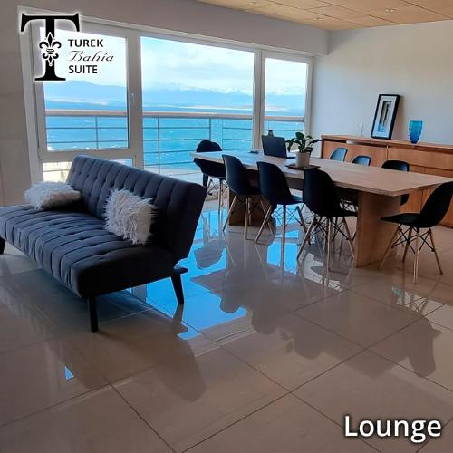 a living room with a couch and a table at Turek Residences in Ushuaia
