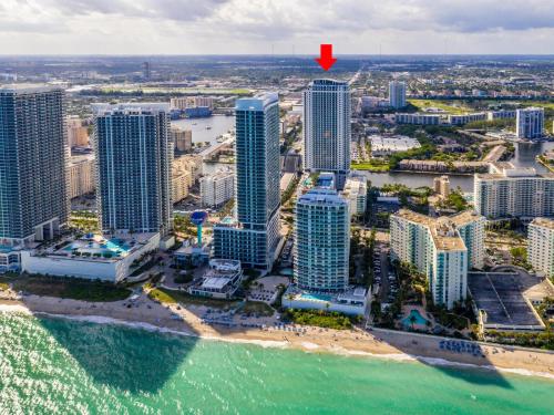 an aerial view of a city with a red arrow at HYDE BEACH HOUSE #2408 THREE-BEDROOM, WATERFRONT, OCEAN AND INTERCOSTAL VIEW, ROOFTOP POOL, 5 MiN WALK TO BEACH in Hollywood