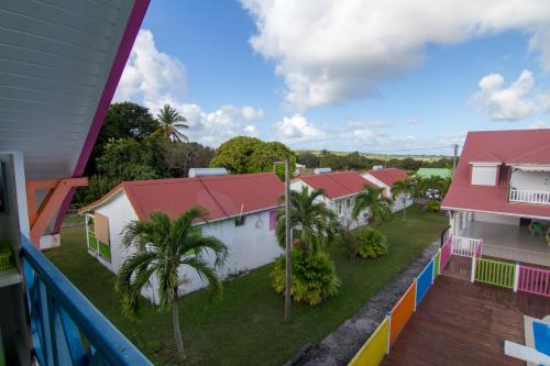 arial view of a row of houses with red roofs at Chambres d'hôte Beauséjour in Beauséjour