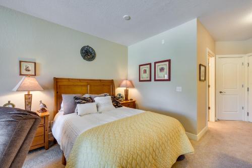 a bedroom with a bed and a couch at Cozy Birchwood Condo on Tagalong Golf Course! in Birchwood