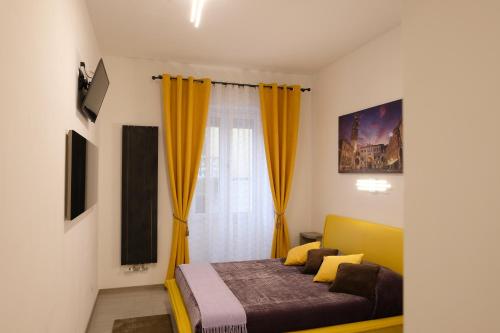 a bedroom with a bed and a window at LeNotti Verona in Verona