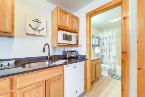 a kitchen with a sink and a microwave at Wells Vacation Rental about 1 Mi to Beach Access! in Wells