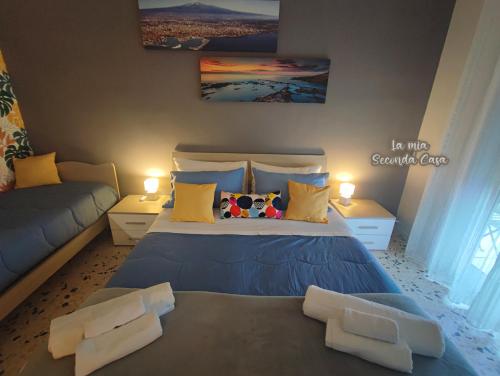 Ένα ή περισσότερα κρεβάτια σε δωμάτιο στο La mia seconda casa ad Aci Castello