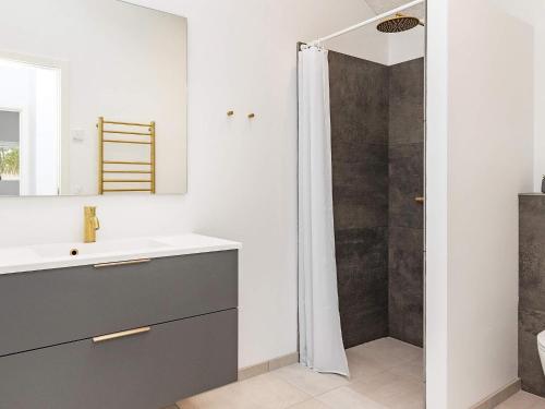 a bathroom with a sink and a shower at 10 person holiday home in Jerup-By Traum in Jerup