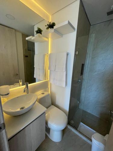 a bathroom with a sink and a toilet and a shower at Infinity Blue - Playa Dormida in Santa Marta