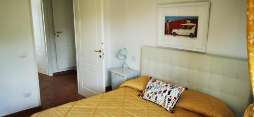 a bedroom with a bed with a pillow on it at B&B Luna Nuova in Sarzana