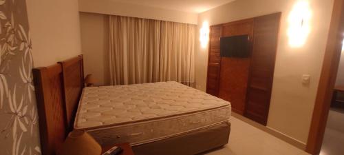 Ένα ή περισσότερα κρεβάτια σε δωμάτιο στο Luppi hotel Propriedade Particular