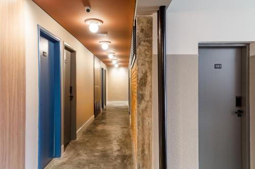 a corridor of an office building with a hallway at ZEST Teodoro in Sao Paulo
