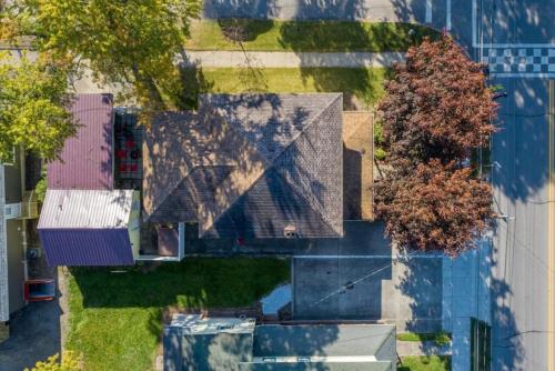 an overhead view of a house with a roof at Walk To Parks, Dining & Lake! Game Room! Hot Tub! in Watkins Glen