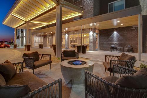 a patio with chairs and a table in a building at TownePlace Suites by Marriott Cincinnati Airport South in Florence