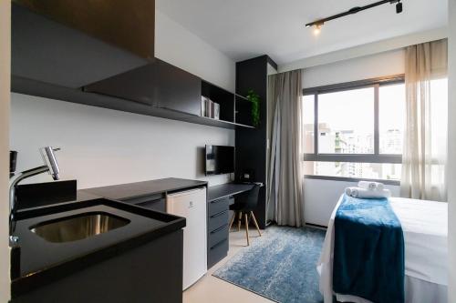 Postel nebo postele na pokoji v ubytování Studios Novíssimos com Piscina no Rooftop e vista para o Allianz Parque