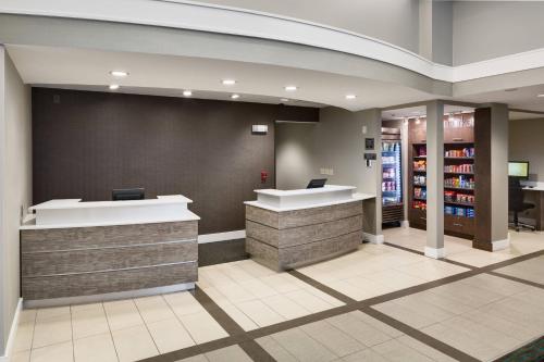 a lobby of a store with a cash register at Residence Inn Milford in Milford
