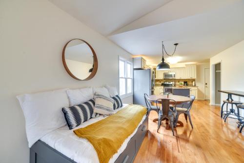 a living room with a white couch and a table at Cadiz Abode with Decks, Fire Pit, and Lake Access in Cadiz