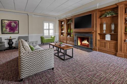 a living room with a couch and a fireplace at Marriott's Fairway Villas in Galloway