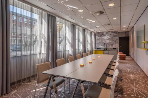 an office meeting room with a table and chairs at Cologne Marriott Hotel in Cologne