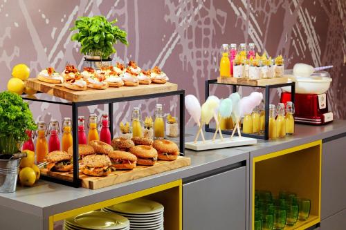 a buffet with food and drinks and pastries at Cologne Marriott Hotel in Cologne