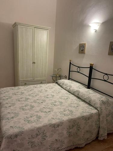 Ένα ή περισσότερα κρεβάτια σε δωμάτιο στο Tosca Apartment con Giardino Privato e AC nell'incantato Borgo Medievale di Suvereto