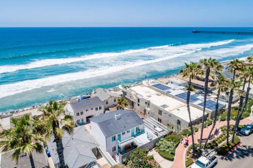 an overhead view of a beach with palm trees at Pacific Villas in Oceanside