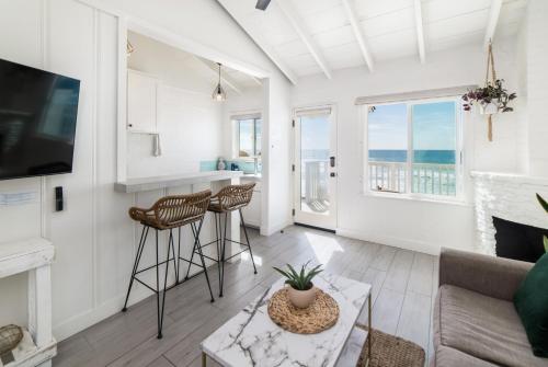 a living room with a view of the ocean at Pacific Villas in Oceanside