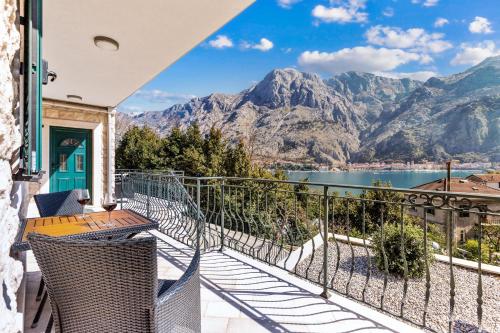 a balcony with a view of a lake and mountains at Apartments Dončić in Kotor
