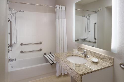 a bathroom with a sink and a shower at Residence Inn by Marriott Atlanta Buckhead in Atlanta