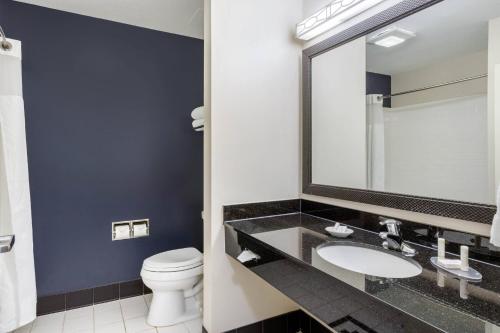 a bathroom with a sink and a toilet at Fairfield Inn & Suites by Marriott Houston Conroe in Conroe