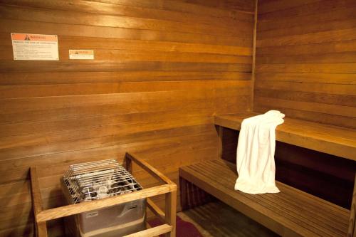 a sauna with wooden walls and a white towel at Fairfield Inn & Suites Modesto in Modesto