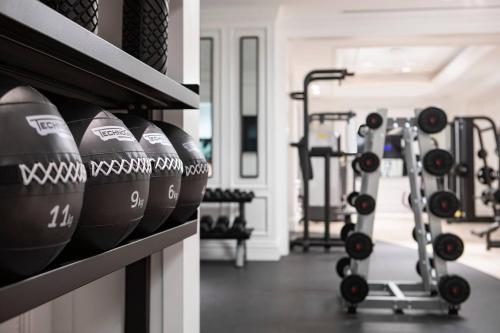 a row of dumbbells on a shelf in a gym at The Ritz-Carlton New York, Central Park in New York