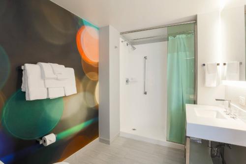 a bathroom with a shower and a sink at Courtyard by Marriott San Francisco Union Square in San Francisco