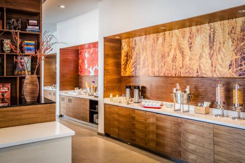 a kitchen with wood paneling and a counter at Fairfield Inn & Suites Queretaro Juriquilla in Querétaro