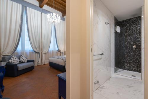 a bathroom with a walk in shower and a tub at Dimora del Cardinale - Residenza d'Epoca in Florence