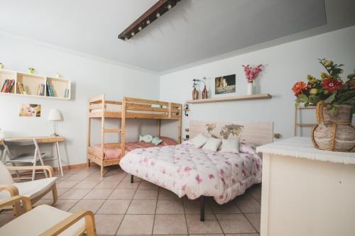Postel nebo postele na pokoji v ubytování B&B LA MIMOSA E IL GELSOMINO