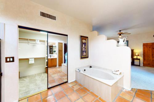 a large bathroom with a sink and a shower at Saguaro Sanctuary in Tucson