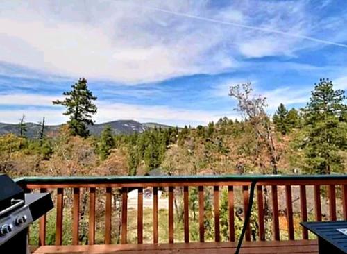 a deck with a view of the mountains at Cozy Moon Cabin in Big Bear Lake