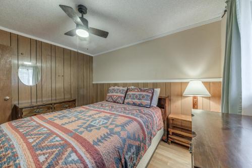 a bedroom with a bed and a ceiling fan at Cloudcroft Cabin Vacation Rental 3 Mi to Skiing! in Cloudcroft