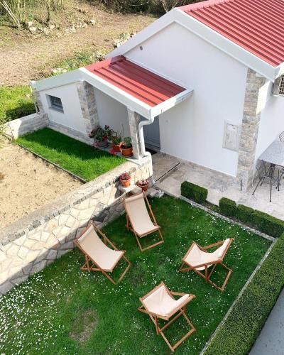 an overhead view of three lawn chairs and a house at Markovic Village Apartments in Ulcinj