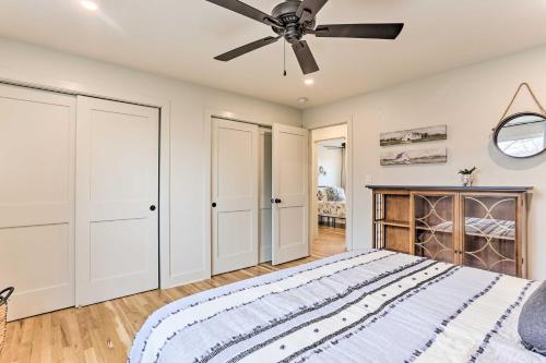 a bedroom with a bed and a ceiling fan at 2 Mi to Dtwn Castle Rock Home with Furnished Patio in Castle Rock