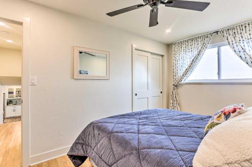 a bedroom with a bed and a ceiling fan at 2 Mi to Dtwn Castle Rock Home with Furnished Patio in Castle Rock