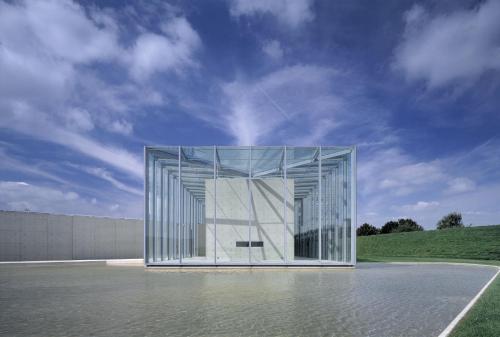 a large glass building with a sky in the background at Holiday Inn Düsseldorf-Neuss by IHG in Neuss