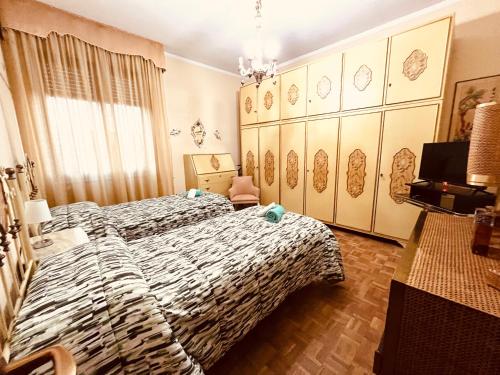 A bed or beds in a room at Affittacamere Umberto&Marisa