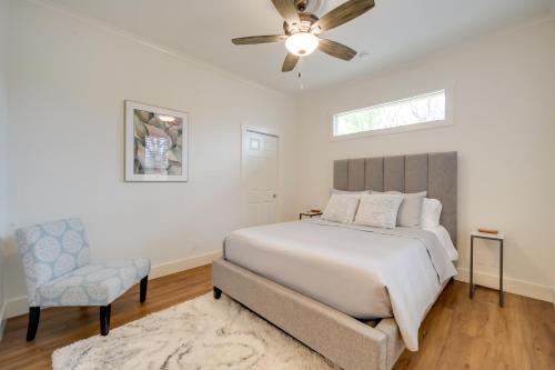 a bedroom with a bed and a ceiling fan at Fredericksburg Home with Pool about 1 Mi to Main Street! in Fredericksburg