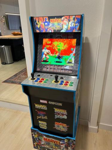 a video game machine in a room with two boxes at Prickly Pear at Cactus Flower-Private HOT TUB-Pet Friendly-No Pet Fees! in Albuquerque