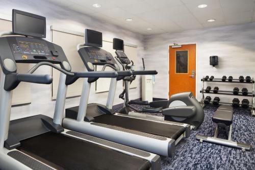 a gym with treadmills and elliptical machines at Fairfield Inn & Suites Worcester Auburn in Auburn