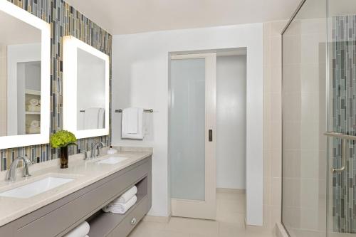 a bathroom with two sinks and a shower at Marriott's Barony Beach Club in Hilton Head Island