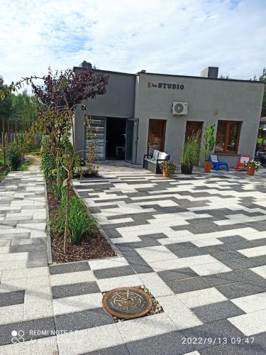 a building with a manhole in the middle of a courtyard at 3-Studio in Poznań