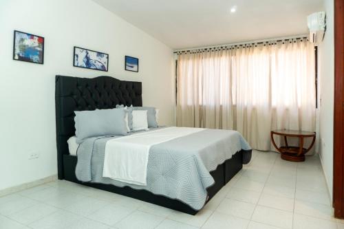 เตียงในห้องที่ Cartagena Classics - Omega House