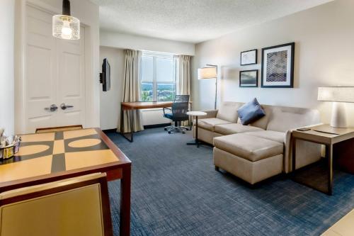 a living room with a couch and a table at Residence Inn Denver North/Westminster in Westminster